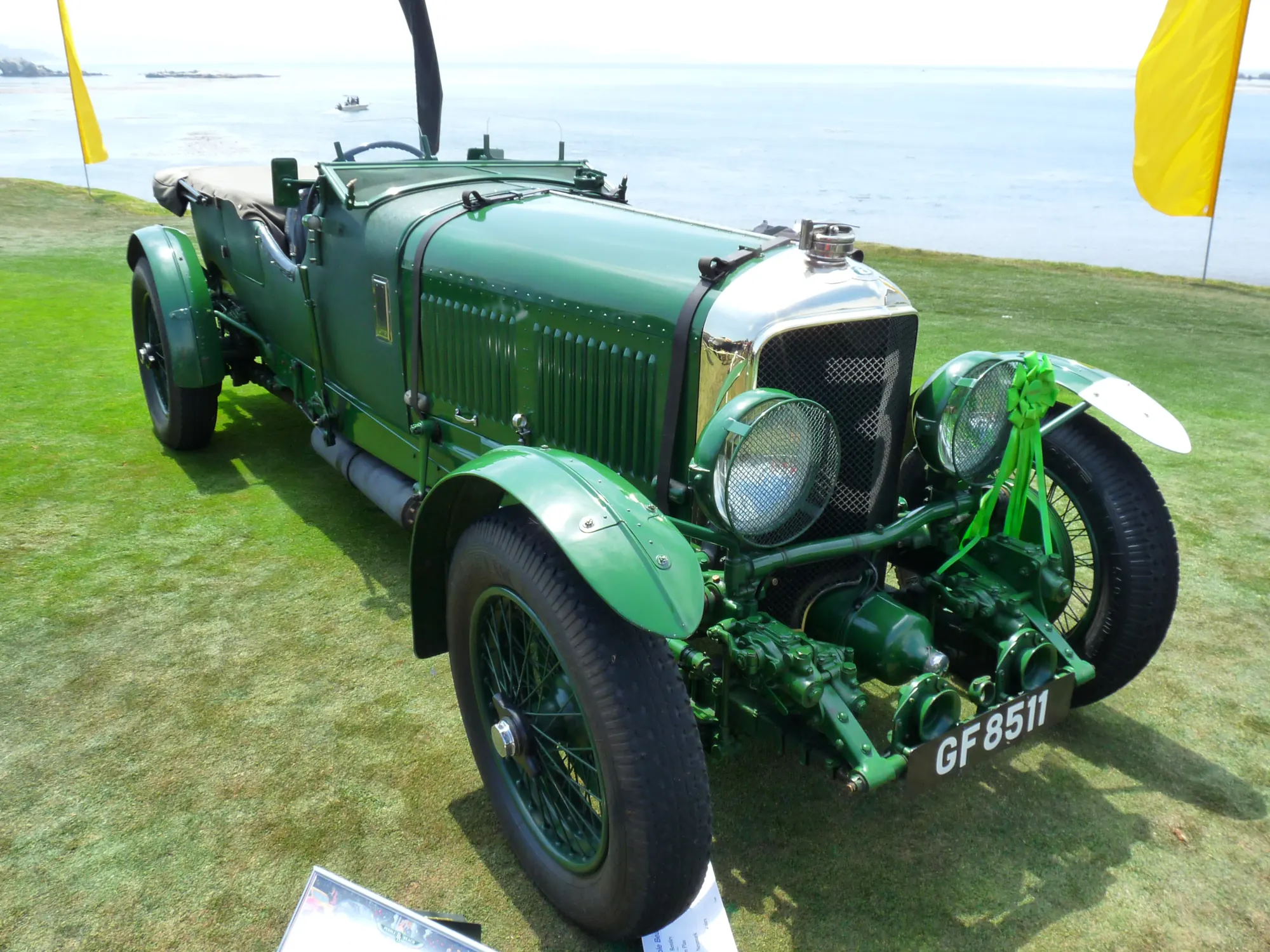 A restored classic Bentley touring car in British racing green